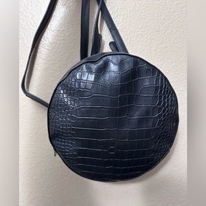 Kaari blue croc material convertible backpack and crodsbody